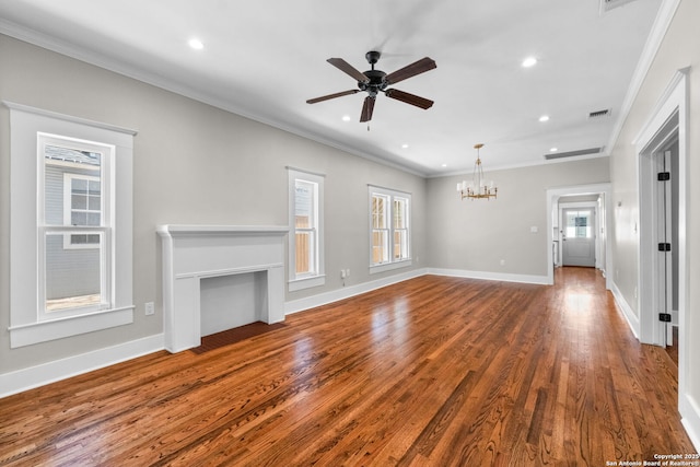 unfurnished living room featuring visible vents, ceiling fan with notable chandelier, ornamental molding, and wood finished floors