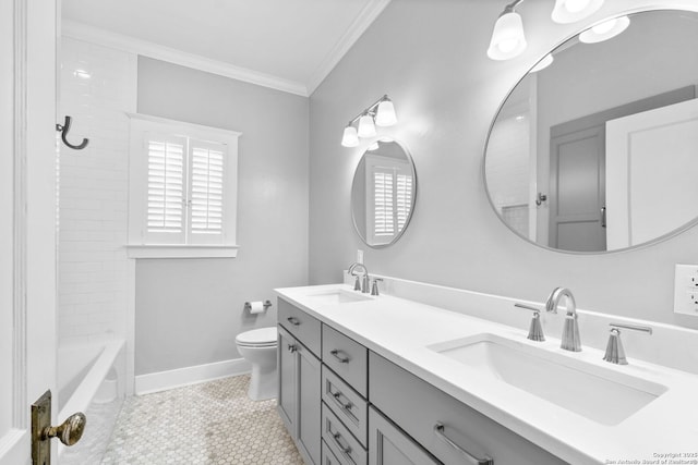 full bath featuring a wealth of natural light, ornamental molding, toilet, and a sink