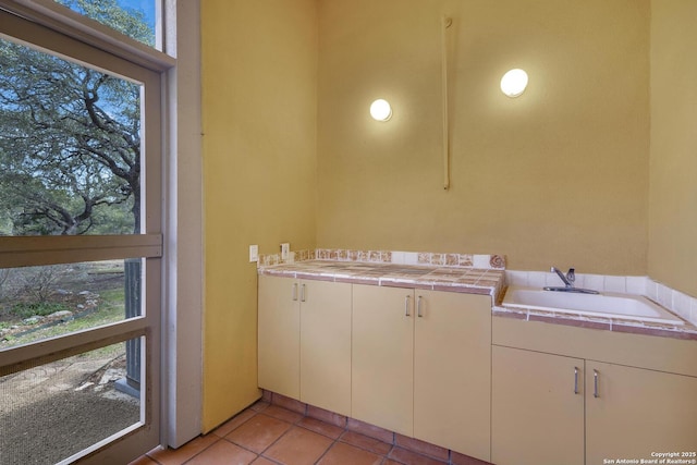 interior space with tile patterned floors and plenty of natural light