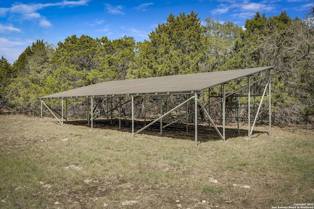 view of outbuilding with a forest view