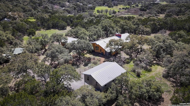 aerial view featuring a view of trees