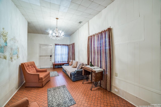 living area featuring a notable chandelier