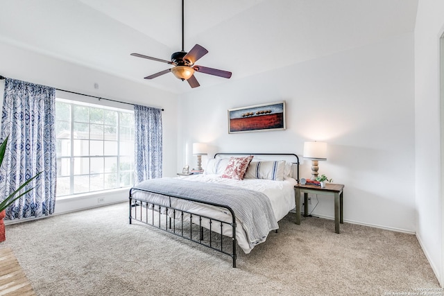 carpeted bedroom with baseboards and ceiling fan