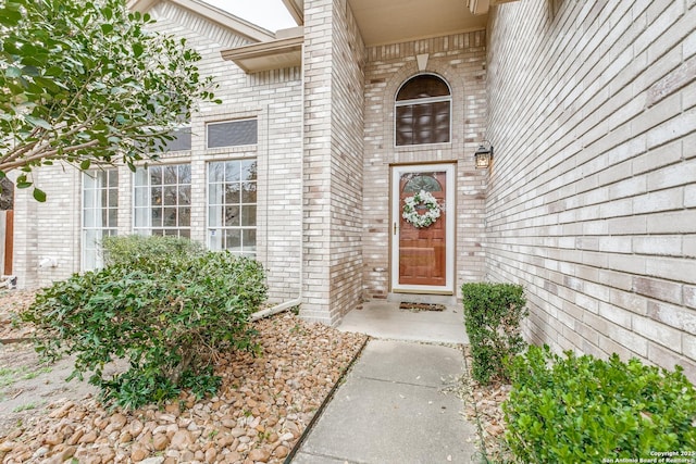 entrance to property with brick siding