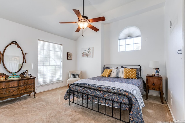 bedroom featuring baseboards, multiple windows, carpet, and lofted ceiling