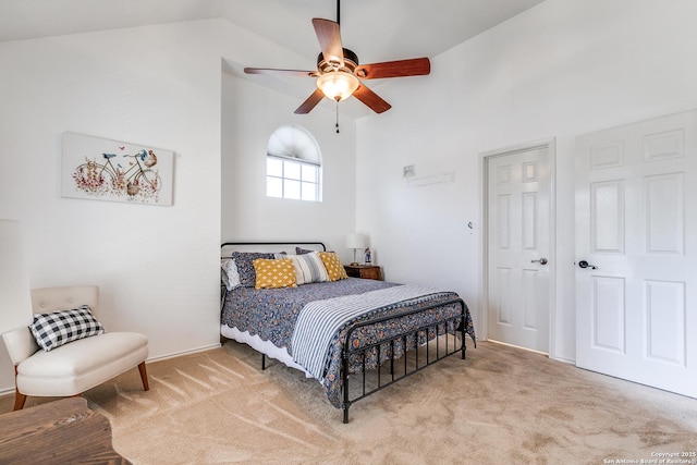 carpeted bedroom featuring a ceiling fan and lofted ceiling