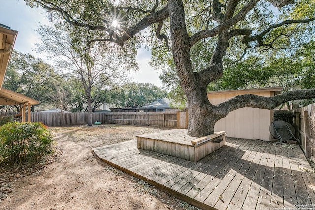 deck featuring a fenced backyard