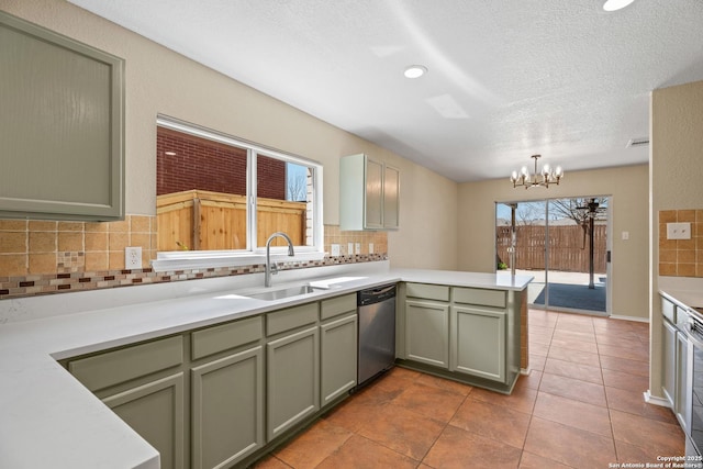 1967 Club Xing, New Braunfels, TX 78130 - kitchen with green cabinets, dishwasher, a peninsula, a notable chandelier, and a sink