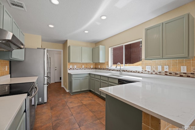 1967 Club Xing, New Braunfels, TX 78130 - kitchen featuring electric range, visible vents, a sink, under cabinet range hood, and light countertops
