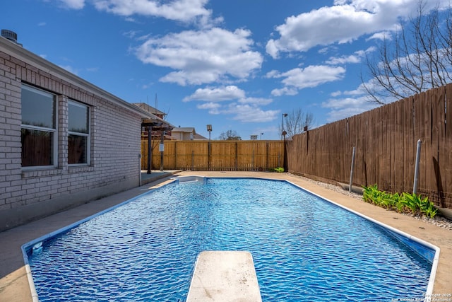 1967 Club Xing, New Braunfels, TX 78130 - view of swimming pool featuring a fenced in pool, a fenced backyard, and a diving board