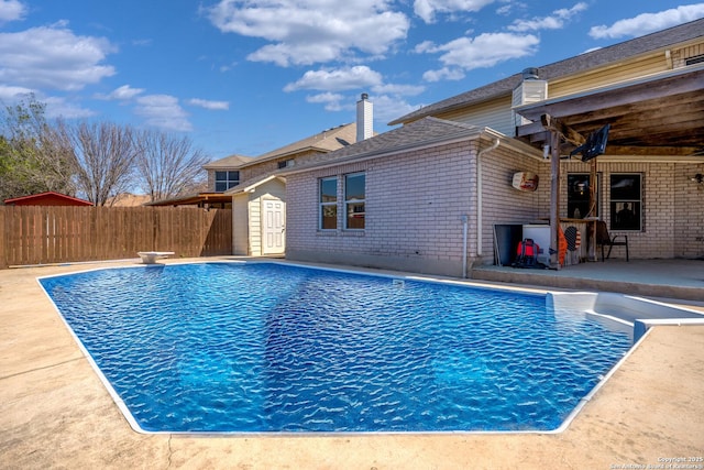 1967 Club Xing, New Braunfels, TX 78130 - view of pool with outdoor dry bar, a fenced in pool, fence, a patio, and a diving board