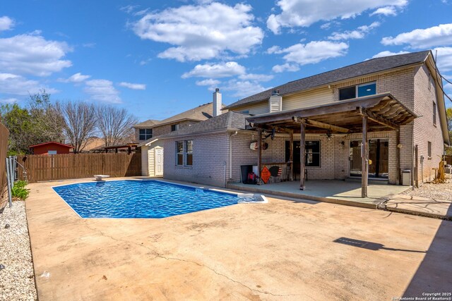 1967 Club Xing, New Braunfels, TX 78130 - view of swimming pool with a diving board, a fenced in pool, a fenced backyard, and a patio area