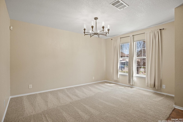 1967 Club Xing, New Braunfels, TX 78130 - carpeted spare room featuring a chandelier, visible vents, a textured ceiling, and baseboards