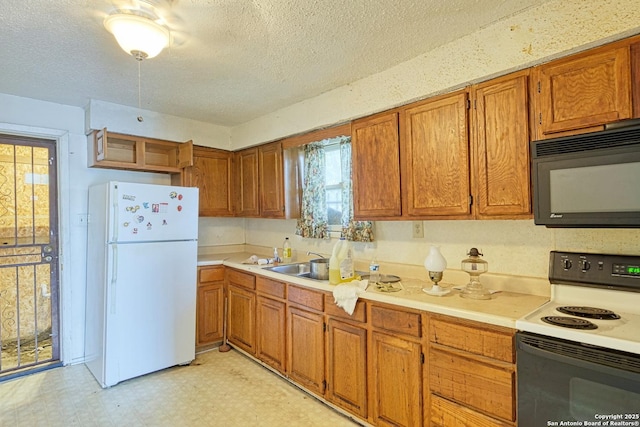 kitchen with white appliances, light floors, brown cabinets, and light countertops