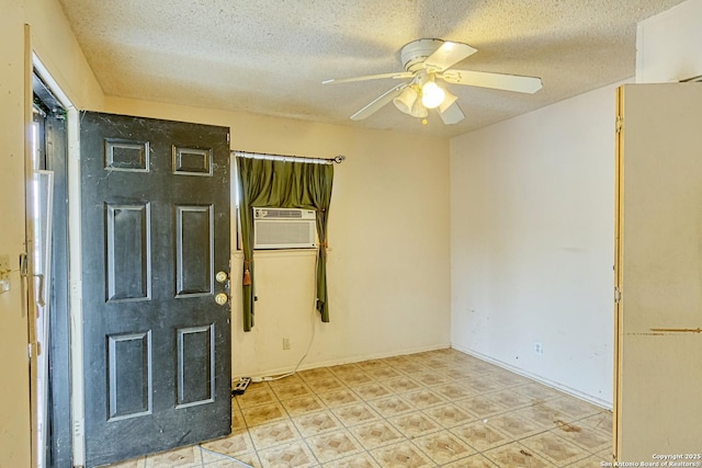 empty room with a textured ceiling and ceiling fan