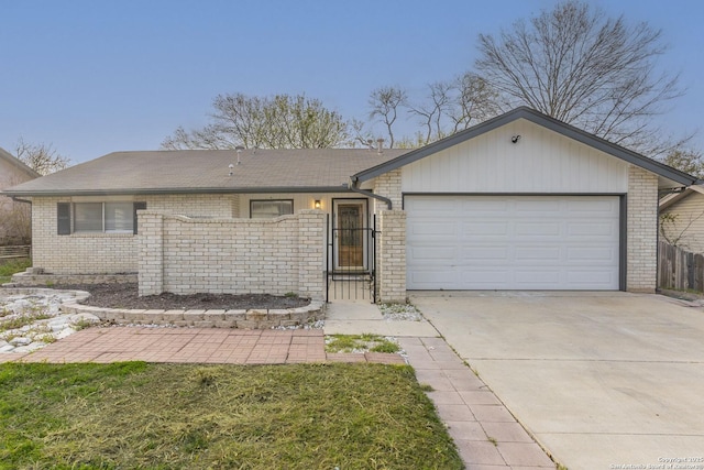 ranch-style house featuring an attached garage, fence, brick siding, and driveway