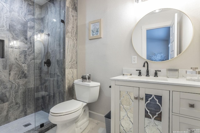 full bathroom featuring vanity, baseboards, a stall shower, toilet, and marble finish floor