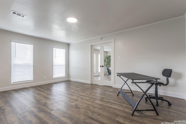 interior space with visible vents, baseboards, ornamental molding, french doors, and dark wood-style flooring