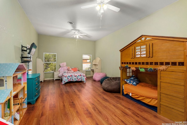 bedroom featuring visible vents and wood finished floors