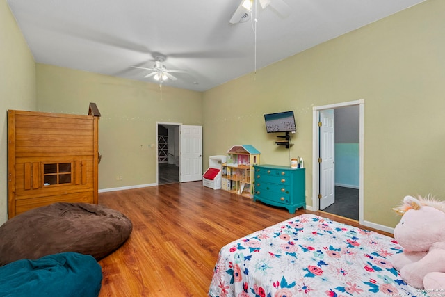 bedroom with ceiling fan, baseboards, and wood finished floors