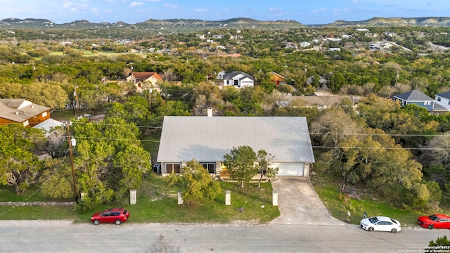 birds eye view of property featuring a mountain view