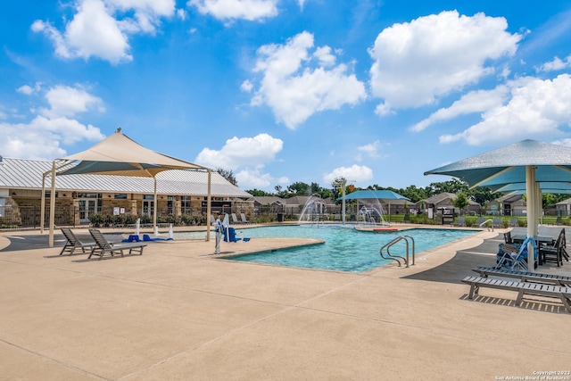 pool featuring a patio area and fence