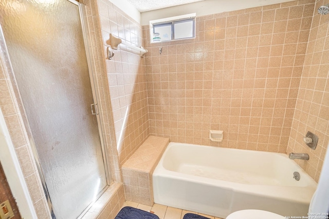 bathroom with tile patterned flooring, a textured ceiling, and enclosed tub / shower combo