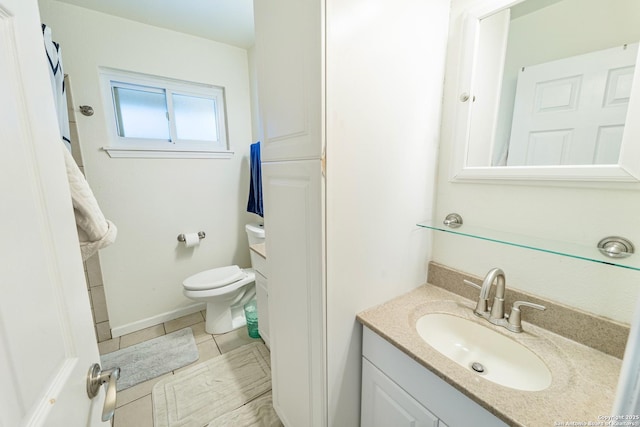 bathroom featuring vanity, tile patterned floors, and toilet