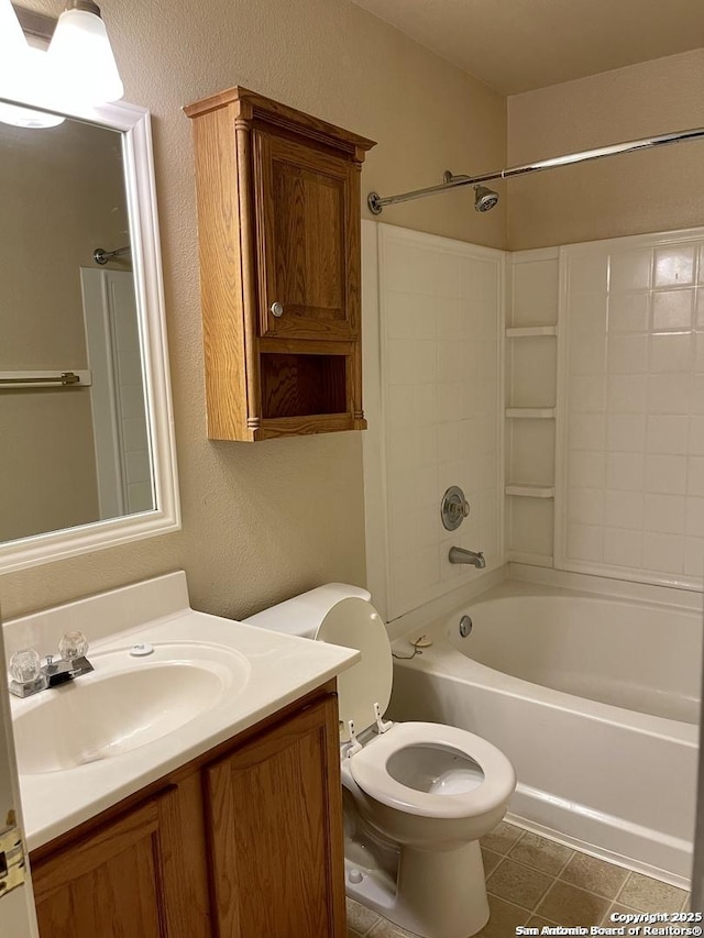 bathroom featuring vanity, shower / tub combination, toilet, a textured wall, and tile patterned floors