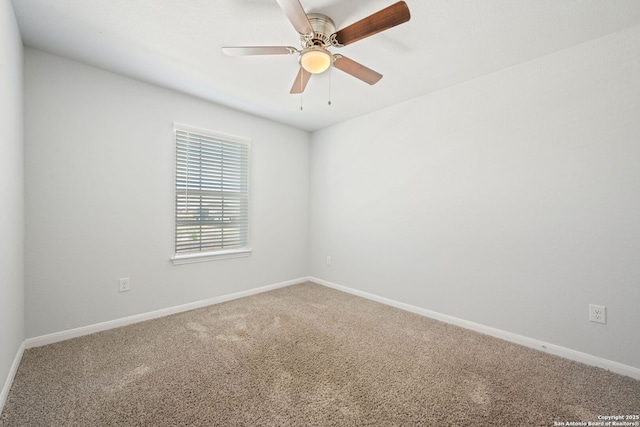 unfurnished room with baseboards, ceiling fan, and carpet flooring