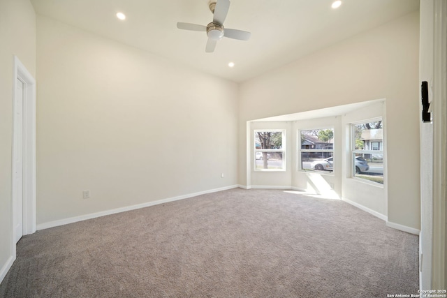 spare room with recessed lighting, baseboards, and carpet floors