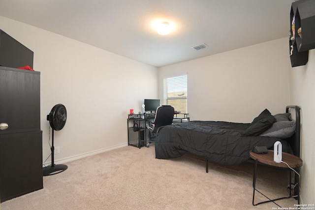 bedroom featuring visible vents, baseboards, and carpet