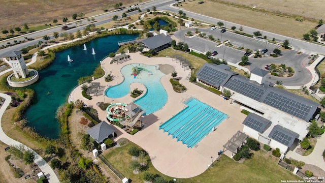 birds eye view of property with a water view