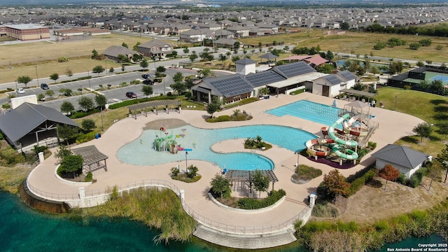 birds eye view of property with a residential view