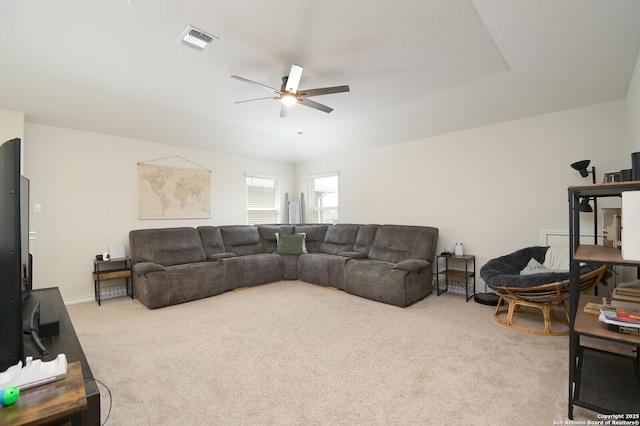 carpeted living area with visible vents and ceiling fan