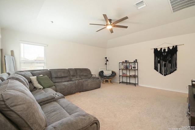 carpeted living area featuring lofted ceiling, a ceiling fan, visible vents, and baseboards