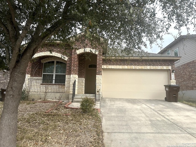 6754 Indian Ldg, San Antonio, TX 78253 - view of front of property with brick siding, stone siding, an attached garage, and driveway