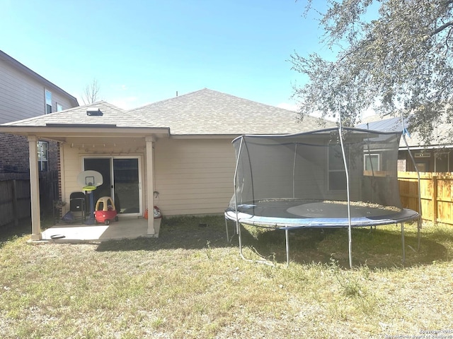 6754 Indian Ldg, San Antonio, TX 78253 - back of house with a trampoline, a patio, and roof with shingles