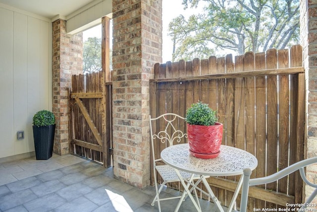 view of patio / terrace with fence and a gate