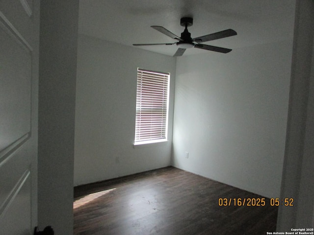 spare room with a ceiling fan and wood finished floors