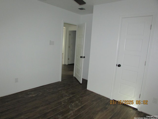 empty room with dark wood finished floors