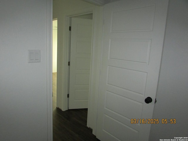 hallway featuring dark wood finished floors