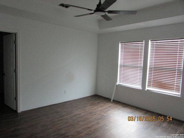 unfurnished room featuring wood finished floors and a ceiling fan