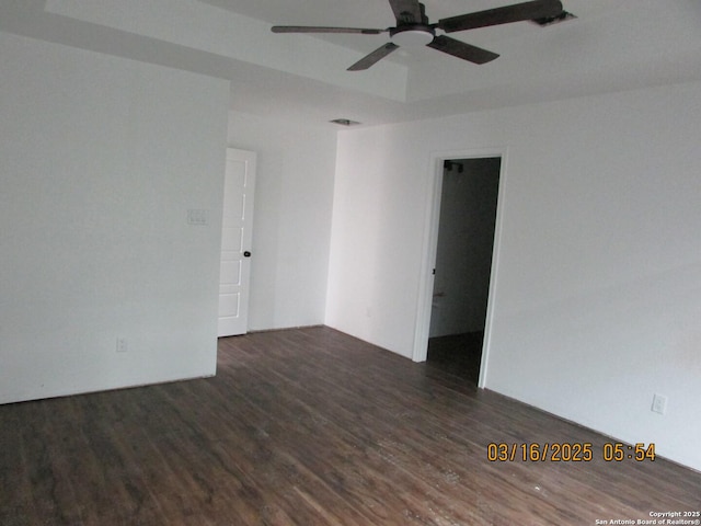 empty room featuring a ceiling fan and wood finished floors