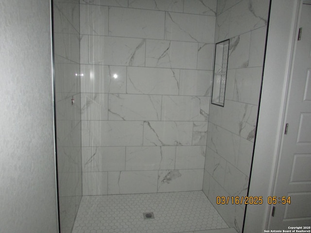 bathroom featuring a shower stall