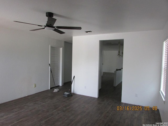 interior space with visible vents, plenty of natural light, ceiling fan, and wood finished floors