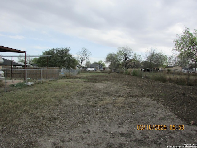 view of yard featuring fence