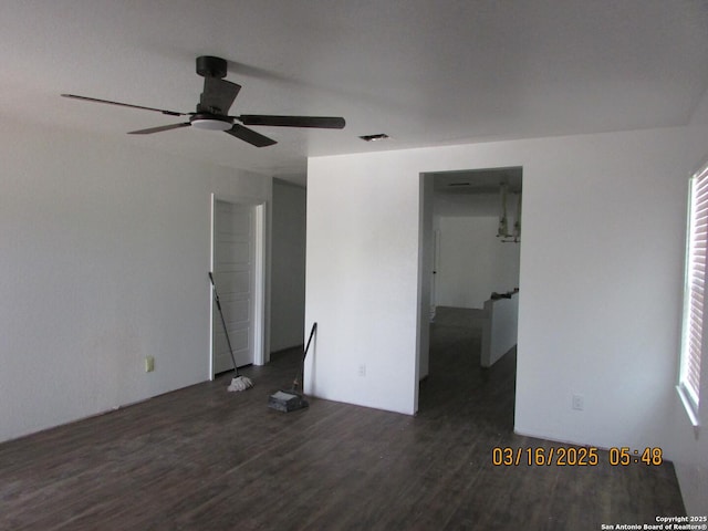 unfurnished bedroom featuring visible vents, wood finished floors, and a ceiling fan