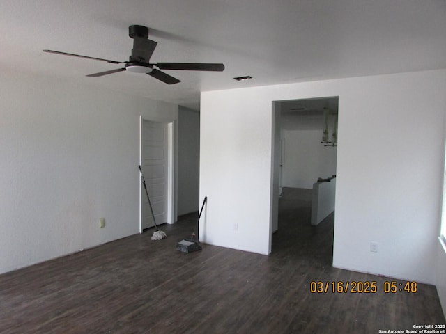 interior space featuring wood finished floors, visible vents, and ceiling fan