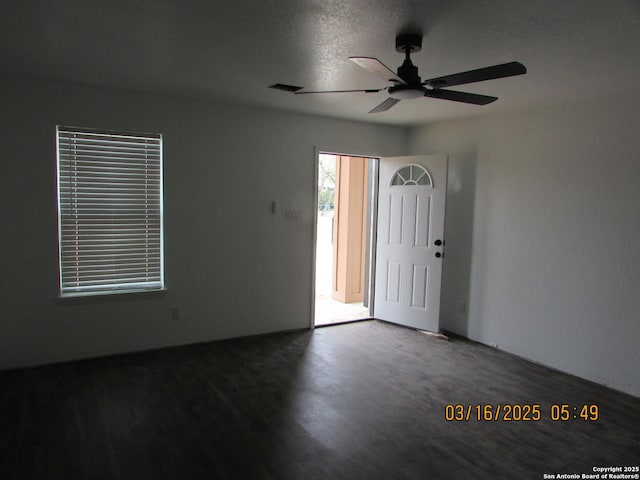 unfurnished room featuring wood finished floors and a ceiling fan